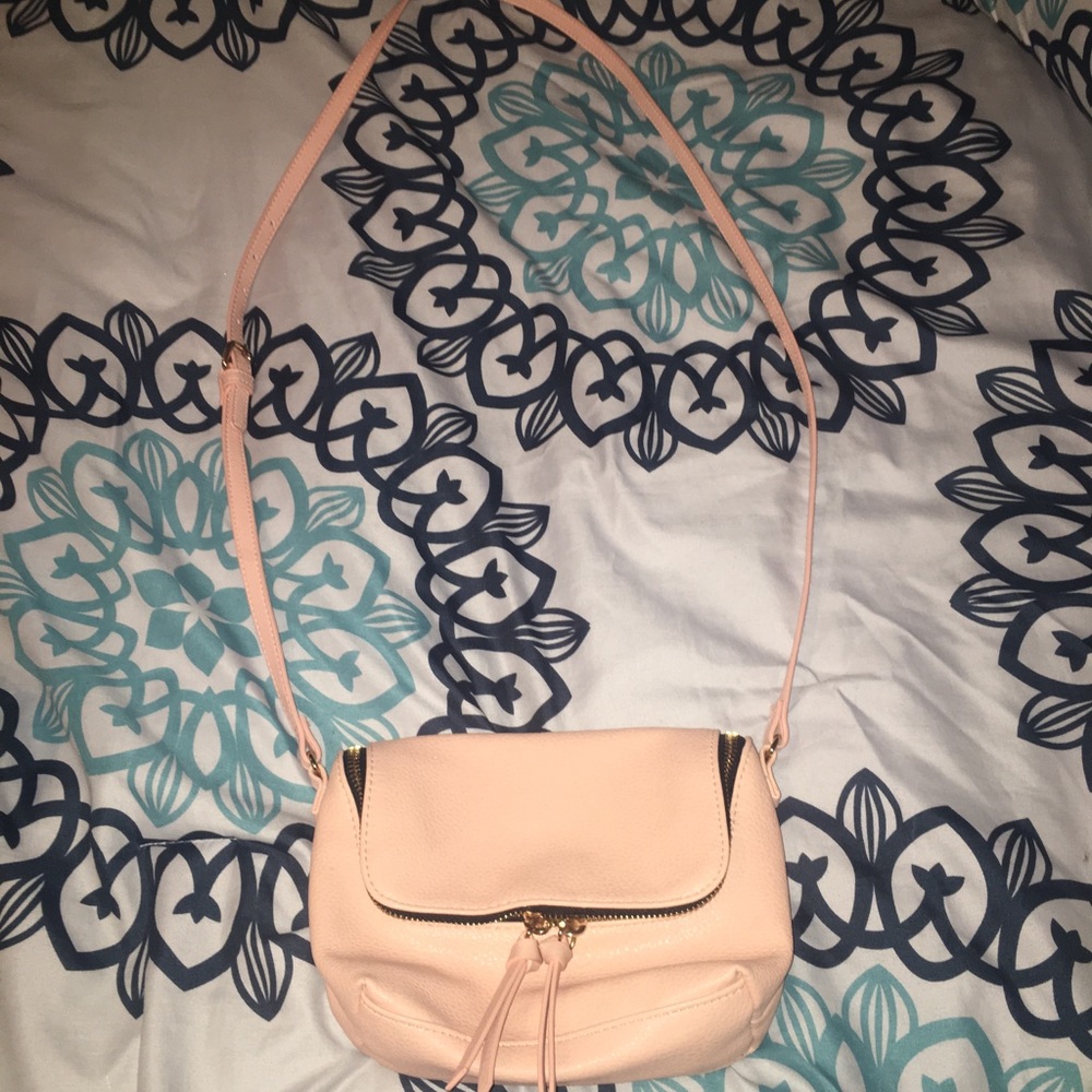Small size cross body purse.